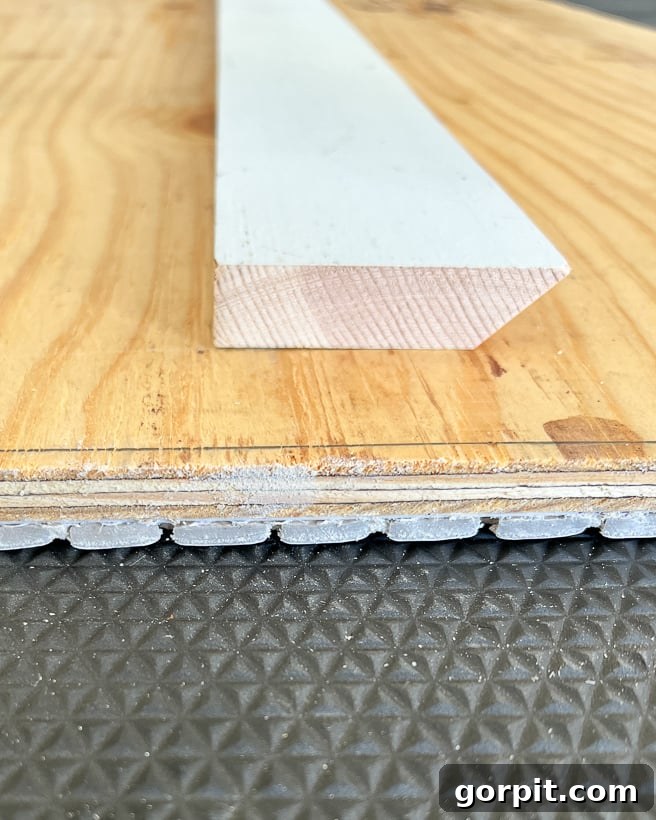 Personalized Message Headboard: Build Your Own 10 Side view of a French cleat for hanging the heavy DIY headboard