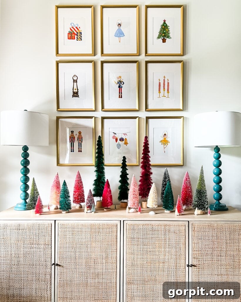 Our 2021 Christmas Home A Kaleidoscope of Color 20 Foyer decorated with Nutcracker art prints and a collection of colorful bottlebrush trees.