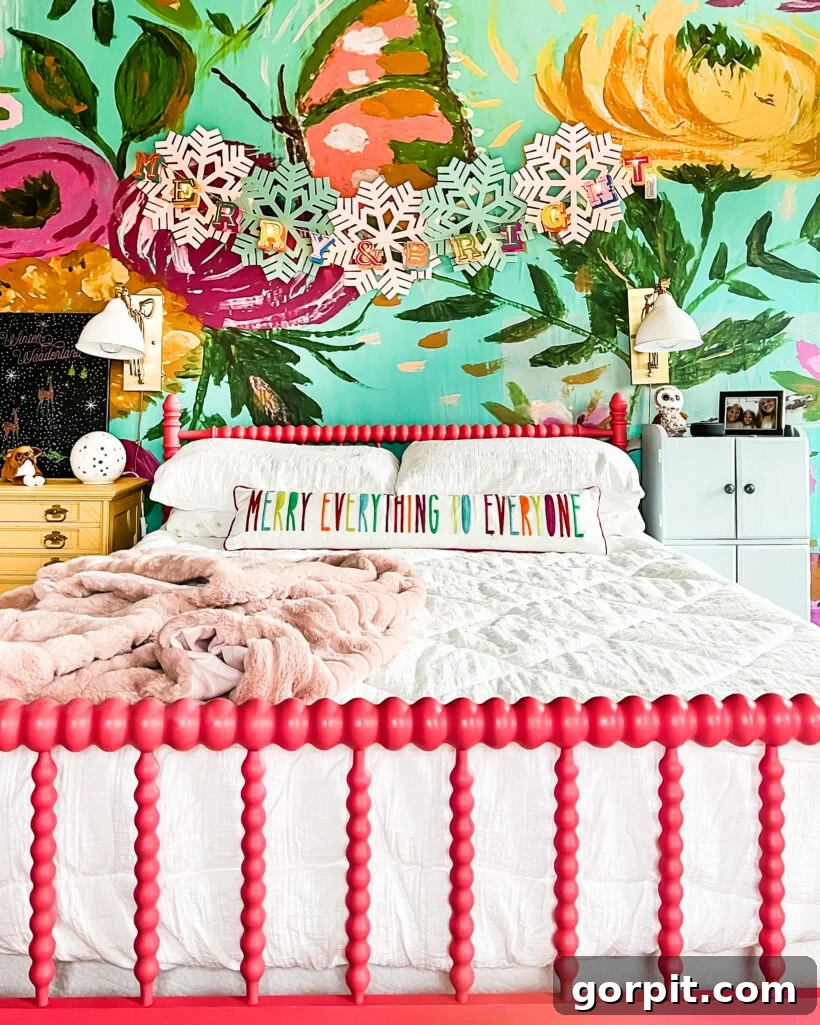 Vibrant Wonderland: Our 2021 Christmas Home Tour Part 2 9 Attley's colorful room with Christmas garland and felt snowflakes