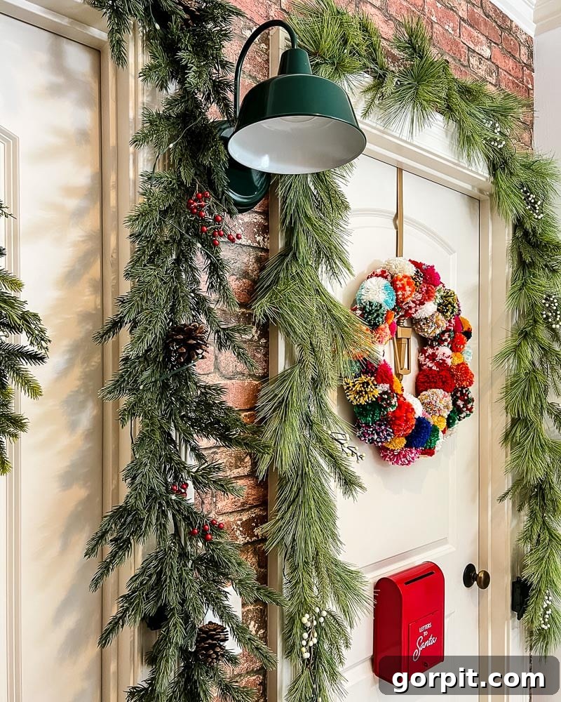 Vibrant Wonderland: Our 2021 Christmas Home Tour Part 2 17 Detailed shot of Christmas decorations on a hallway door, including a small wreath