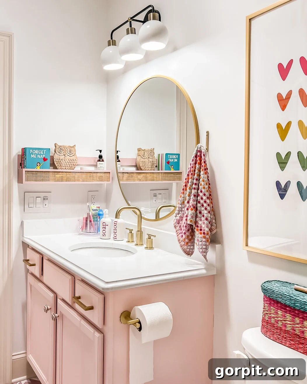 A teen girl's colorful pink and white bathroom makeover on a budget 