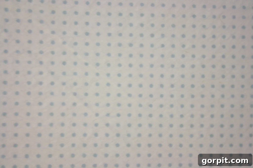 DIY Upholstered Headboard You Can Make This Afternoon 11 Detailed view of fabric stapling on a DIY upholstered headboard