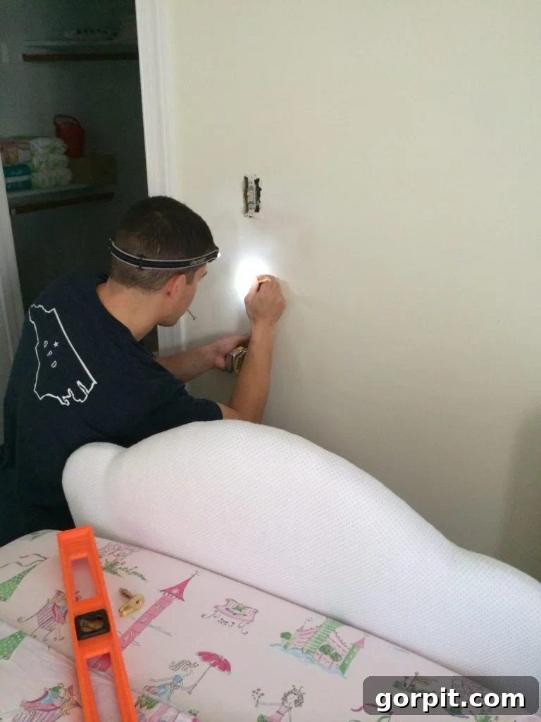 DIY Upholstered Headboard You Can Make This Afternoon 12 Hanging the custom upholstered headboard on the wall