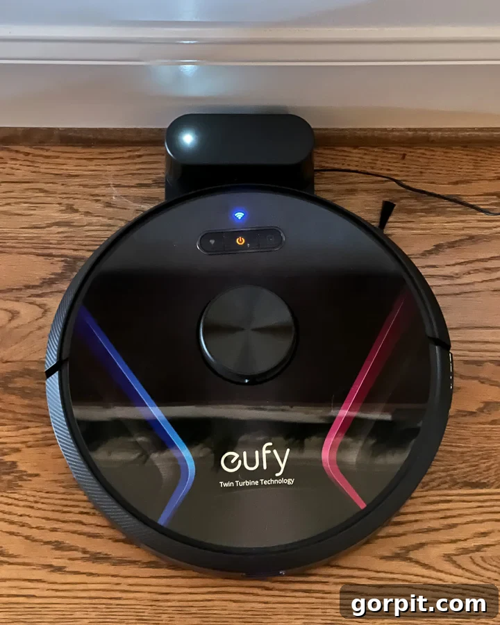 Secrets to a Clean Home with Dogs 4 Eufy robot vacuum cleaner efficiently cleaning floors, ideal for homes with dogs to manage pet hair and dirt.