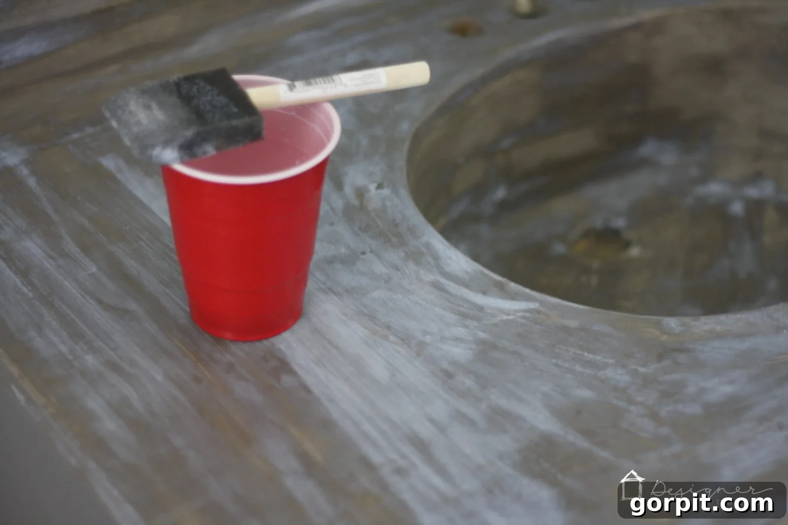 Applying concrete sealer to a finished DIY concrete vanity top