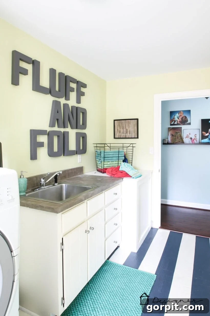 affordable laundry room makeover with painted vinyl floor featuring a charming striped design