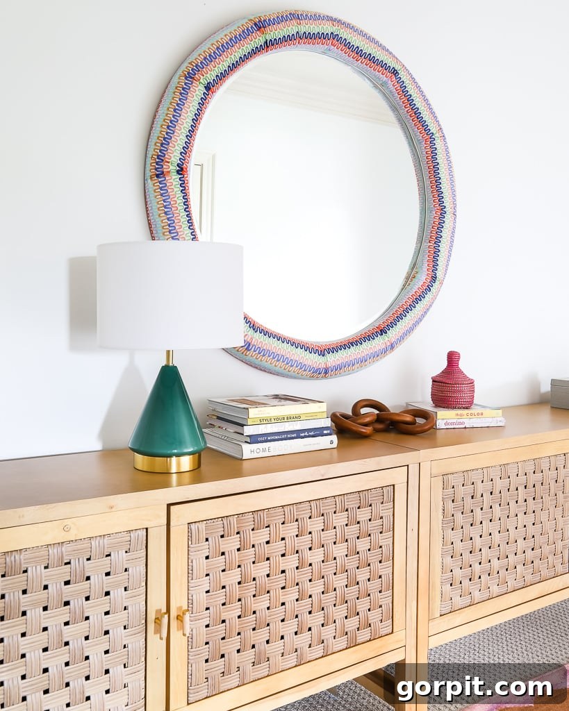 Detailed shot of the custom colorful decoupage mirror in a home setting