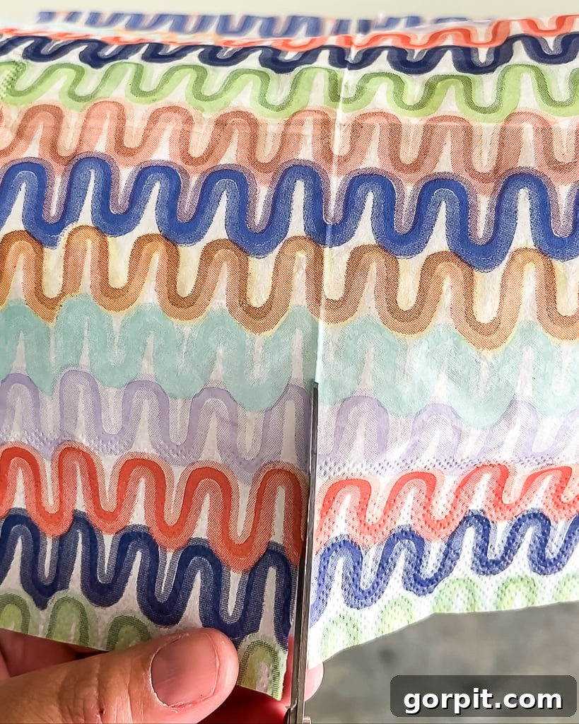 Making relief cuts on a colorful napkin to fit a curved surface