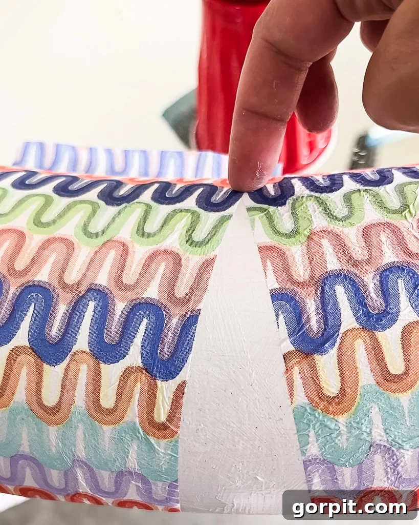 Decoupaged napkins conforming to a rounded mirror surface