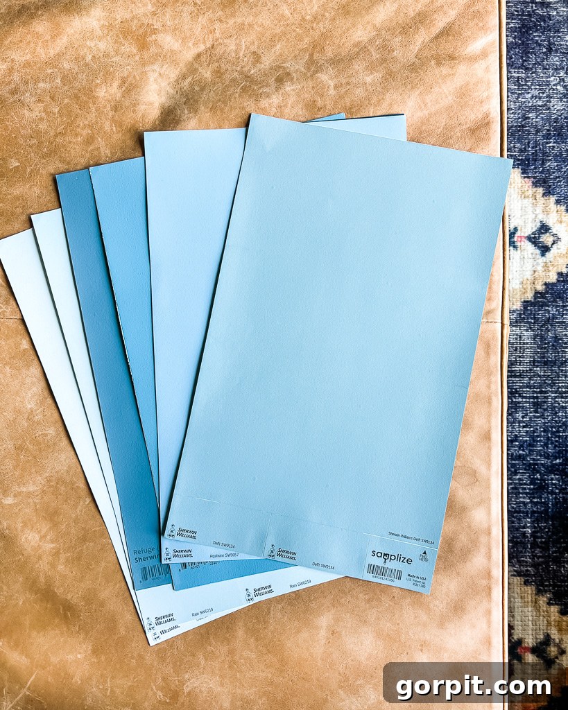 Various Samplize peel and stick paint samples laid out, showcasing the range of available colors and brands.