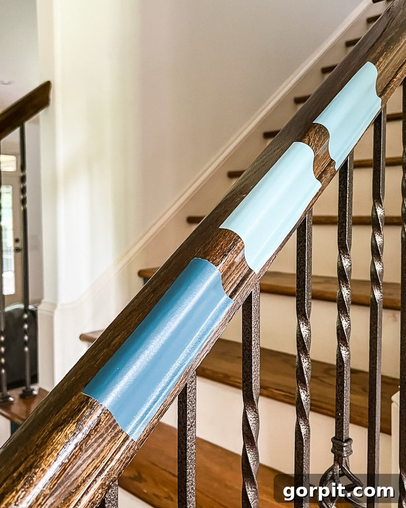 Samplize peel and stick paint samples applied to a stair handrail, showcasing versatility in testing various surfaces.