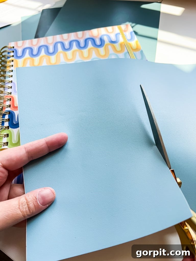 A Samplize peel and stick paint sample being cut into smaller pieces, illustrating its versatility.
