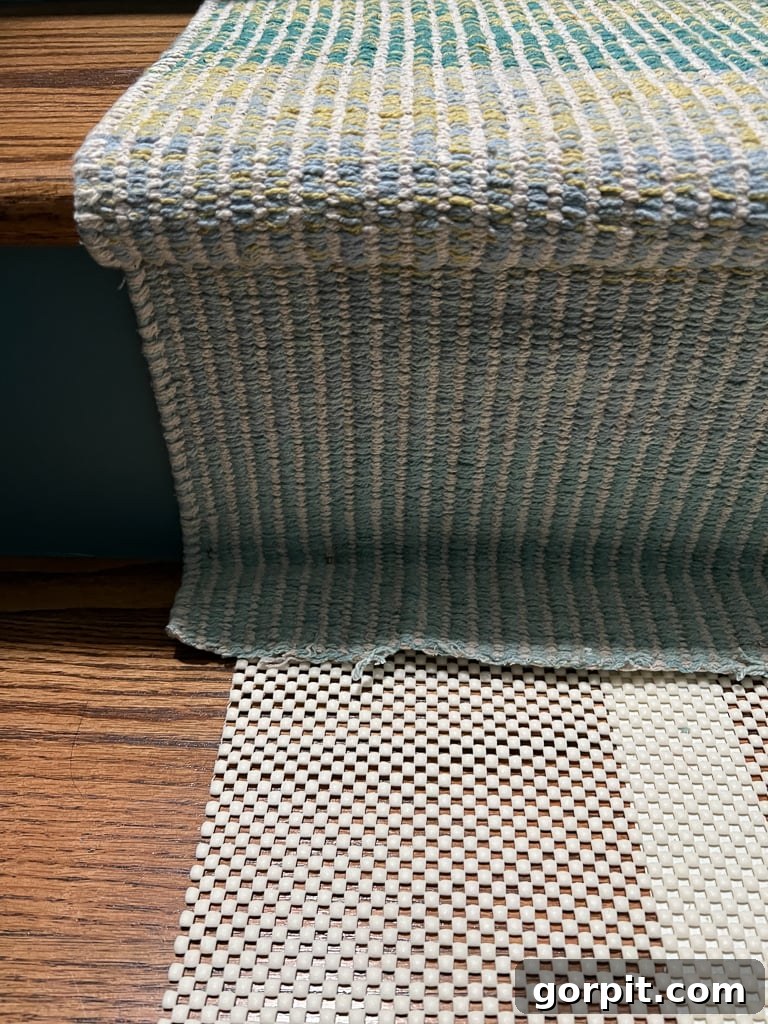 Close-up of the end of a stair runner being cut to prepare for joining with the next section