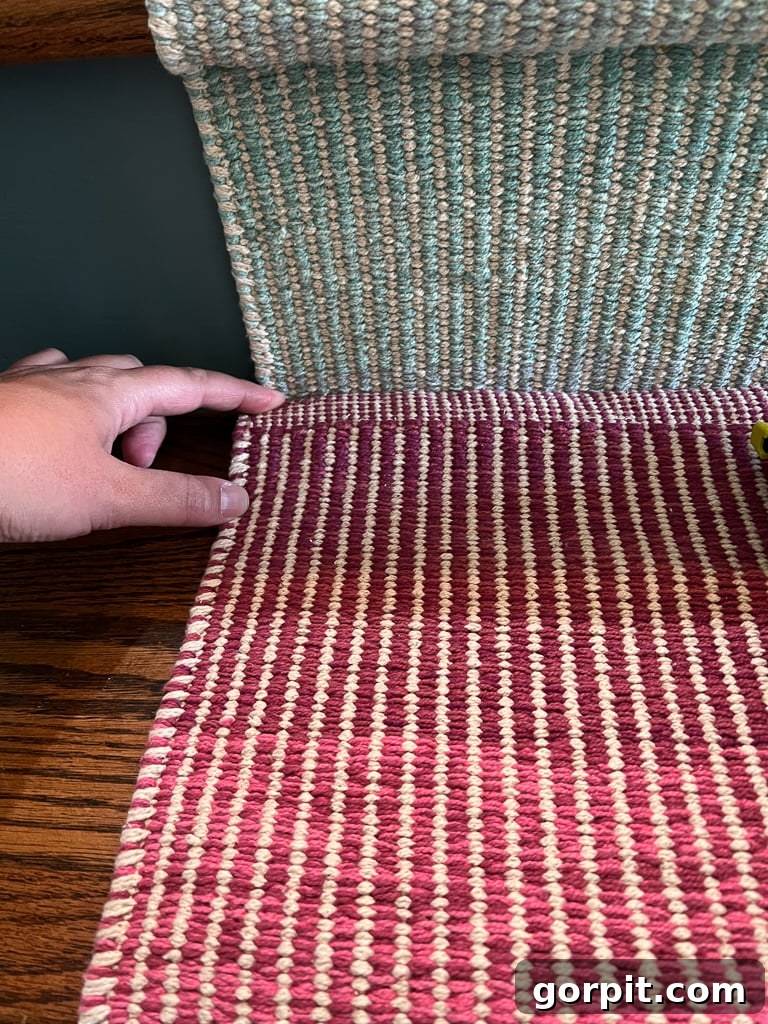 Demonstration of overlapping two stair runner sections and stapling them together for a seamless join