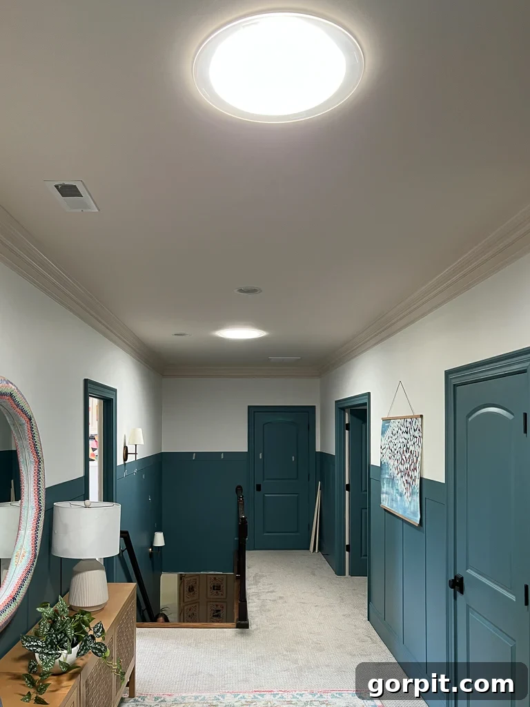 Velux sun tunnels installed in hallway, showing dramatic increase in light