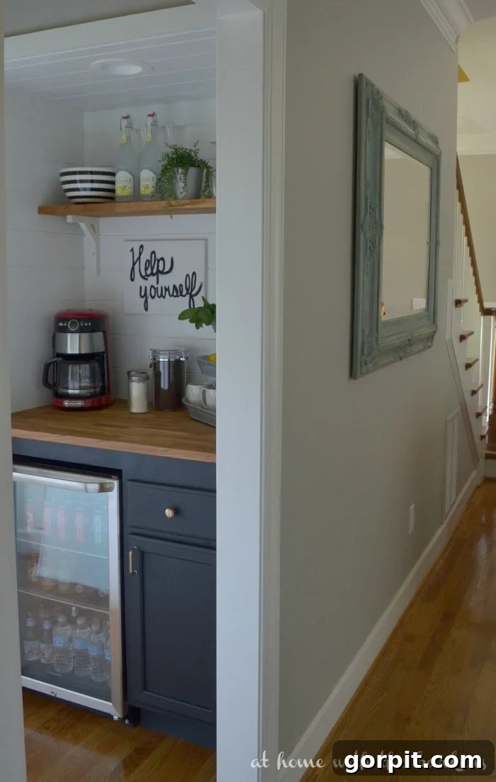 Built-in home coffee bar in a converted closet with mini fridge