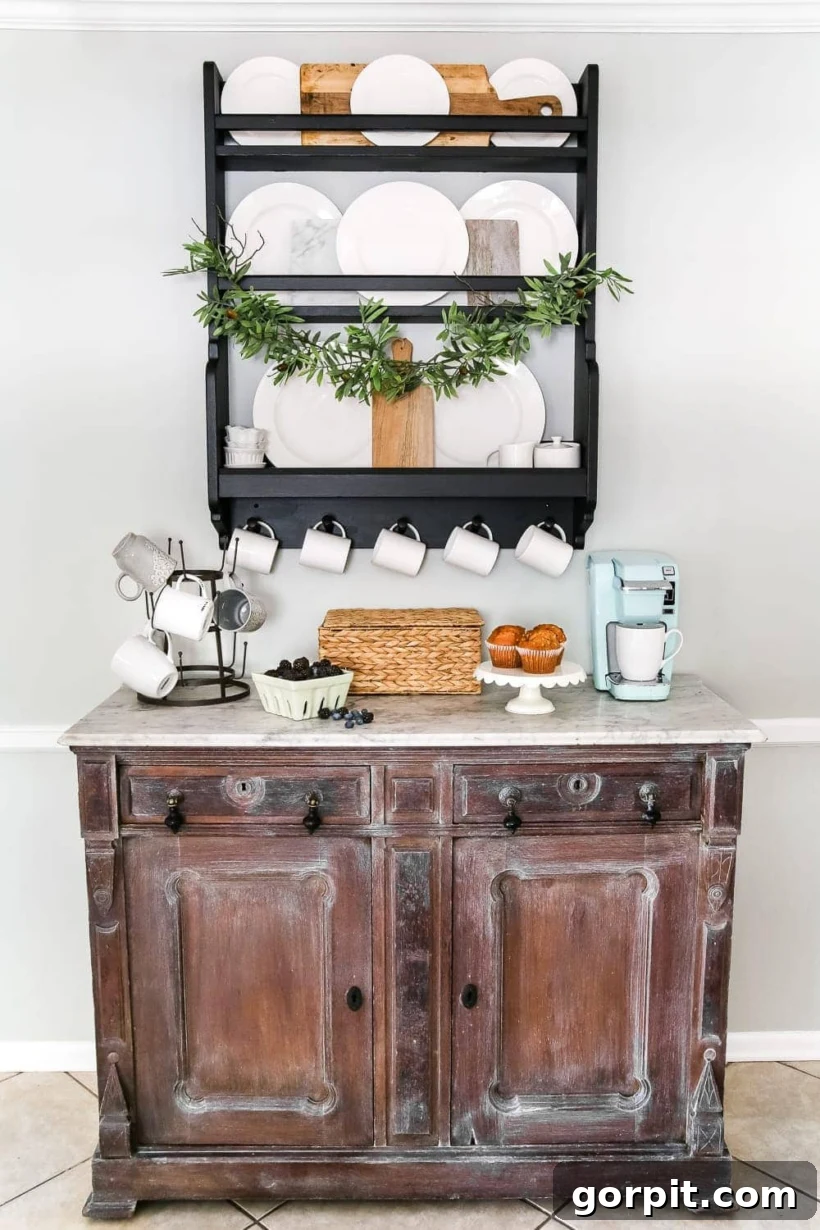 Charming farmhouse coffee bar with a marble-top buffet and mug rack
