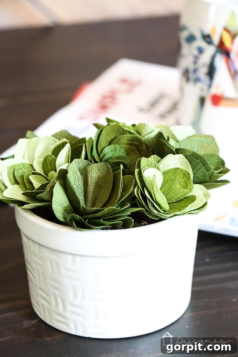 Beautiful crepe paper succulents crafted using precise cuts from a Cricut Maker.