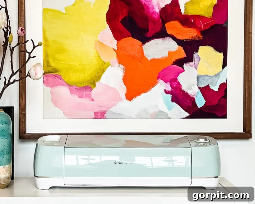 Cricut Explore Air 2 machine in mint green, ready for crafting projects.