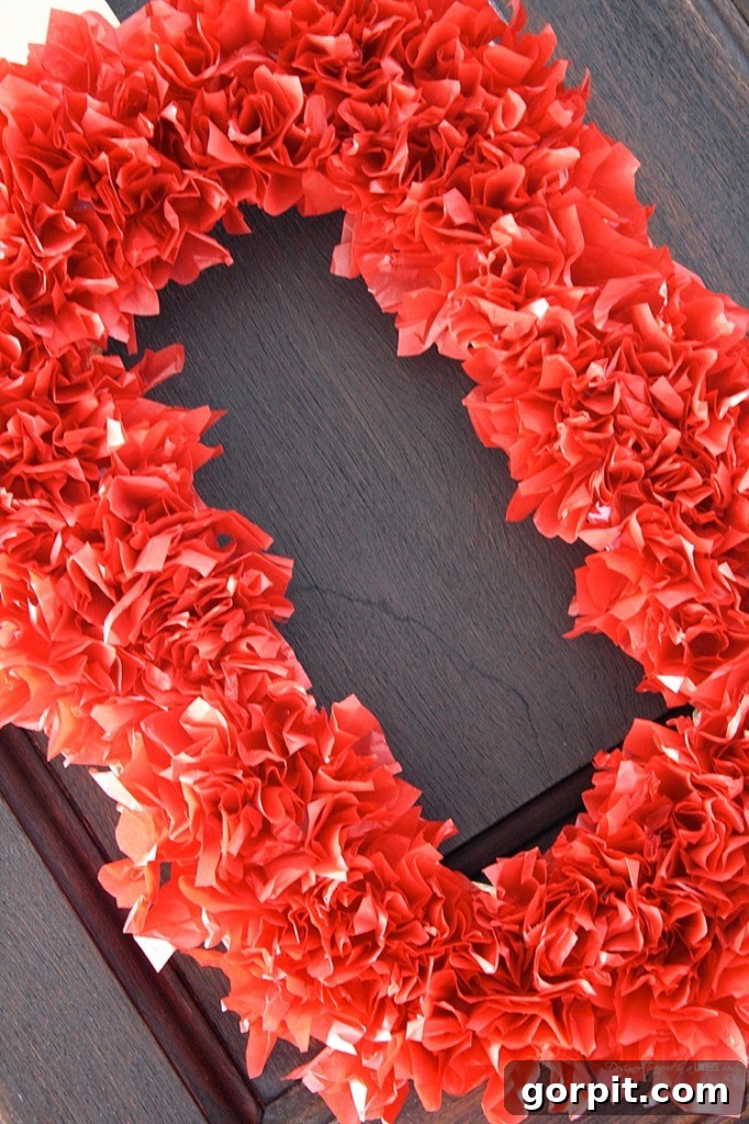 Displaying the delightful DIY Valentine's Day wreath, a perfect handmade touch for your seasonal home decor, radiating charm and cheer.