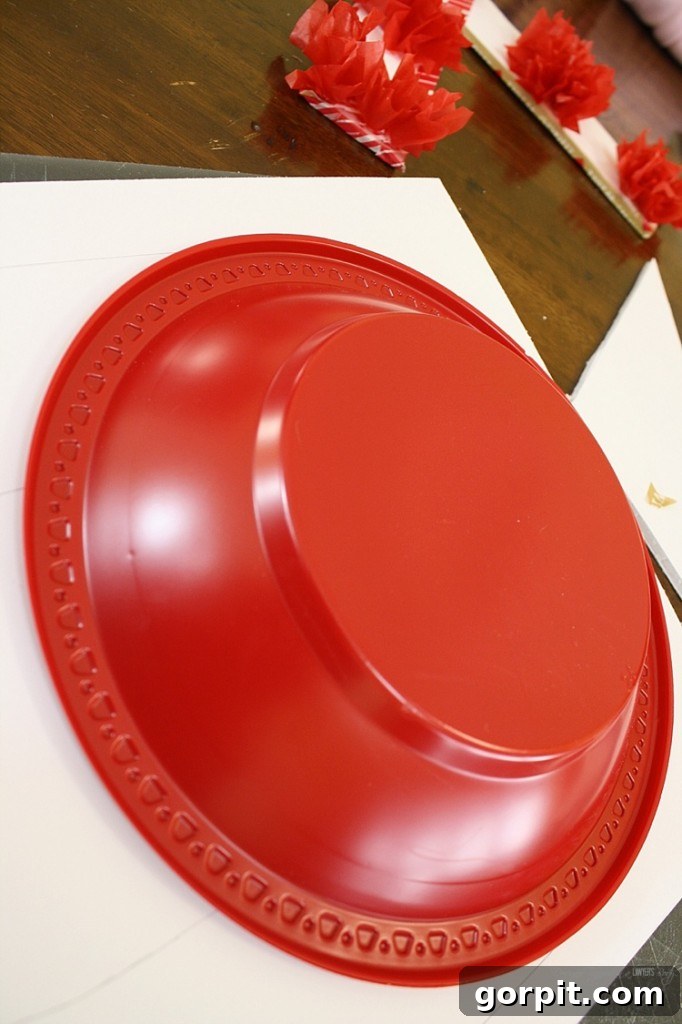 Carefully cut out the 'O' shape from foam core, ensuring smooth curves for your Valentine's Day decor project. Precision in cutting creates a refined base.