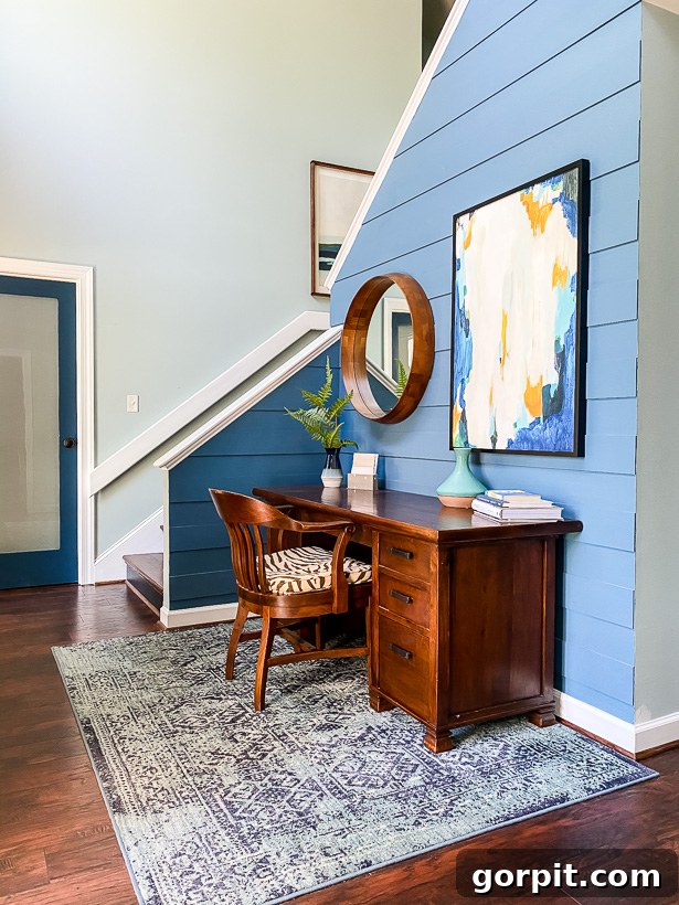 vibrant blue foyer with desk 