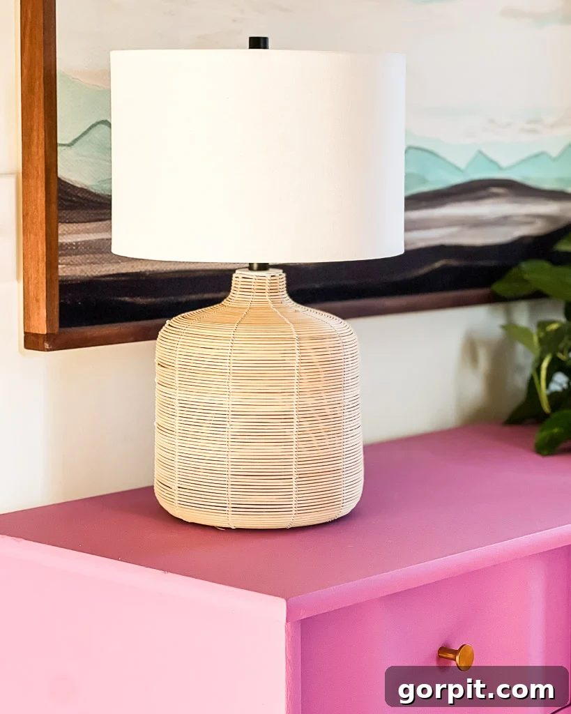Stylish and affordable Pottery Barn dupe lamp illuminating the dresser in the guest room, adding to the layered lighting scheme.