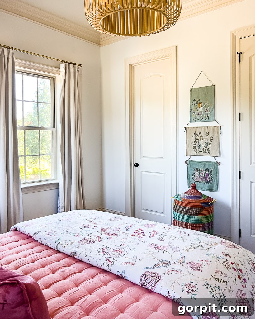 A corner of the colorful guest room featuring vintage embroidered art by the homeowner's grandmother, adding sentimental value and textural interest.