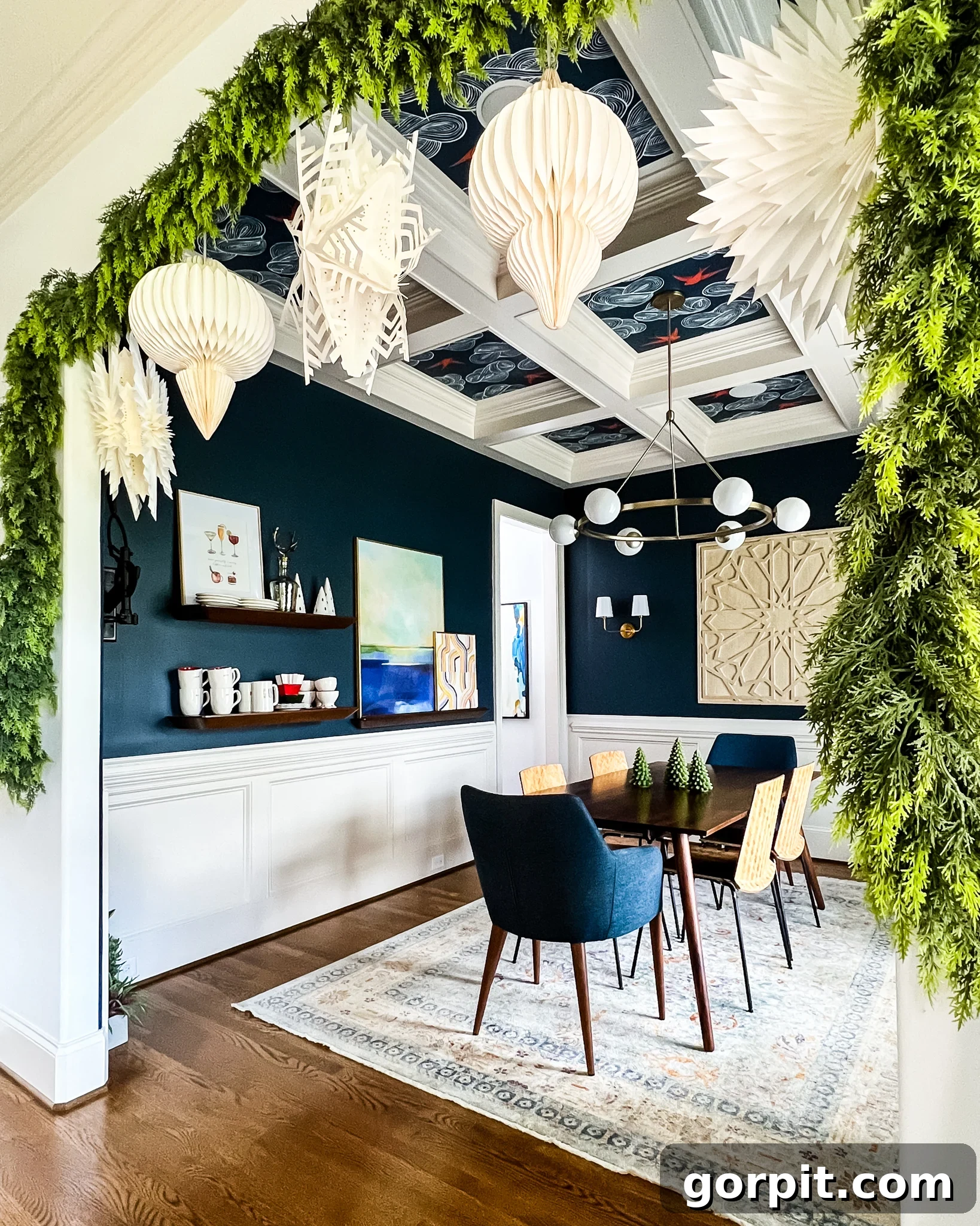 faux cedar garlands hanging in dining room entryway