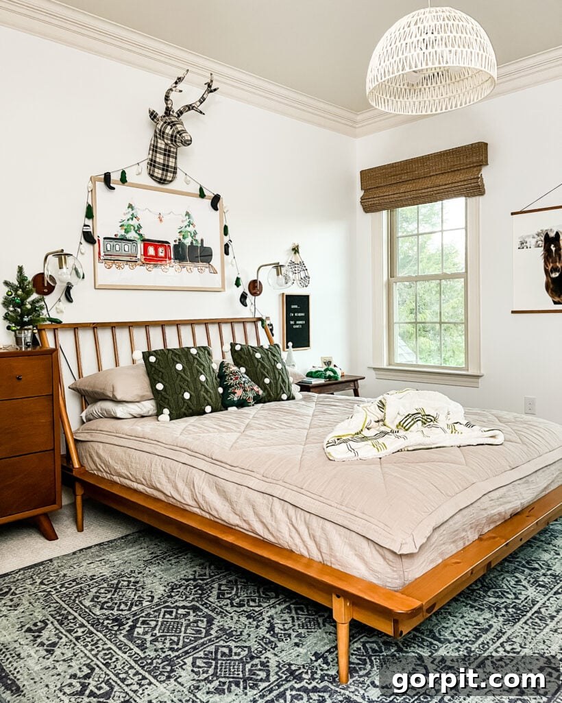 Charming Christmas art displayed above the bed in a girls' bedroom, adding a whimsical and festive touch to the decor.