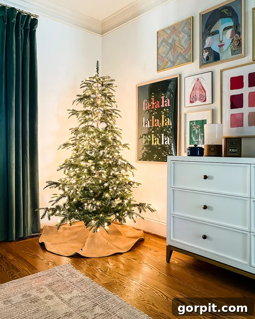 Bringing Christmas Magic to Your Bedroom 4 A festive bedroom featuring a glowing pre-lit Christmas tree in the corner, adding a magical touch to the Christmas decor.