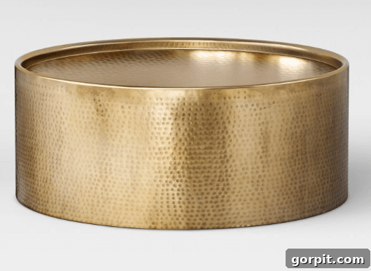 Statement Coffee Table Designs 7 Target hammered drum coffee table in gold, elegant and sculptural