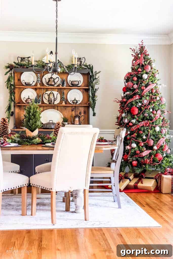 A traditional dining room decorated with classic red and green accents for Christmas, exuding a timeless holiday feel.