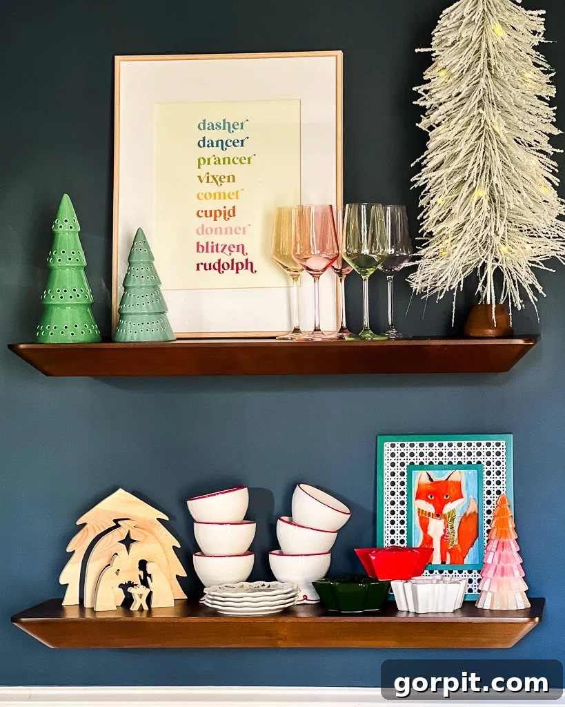 Dining room adorned for Christmas with seasonal artwork and festive holiday dishes, styled by Tasha Agruso of Kaleidoscope Living.
