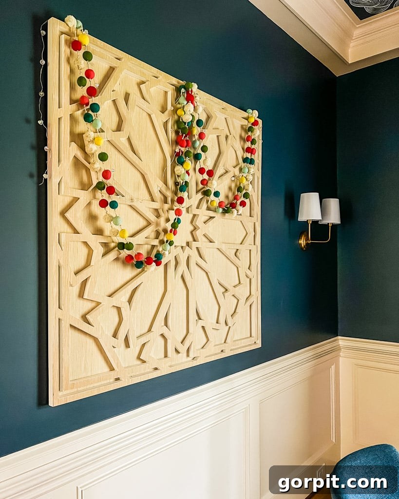 Simple yet elegant Christmas decorations adorning a dining room, beautifully captured by Tasha Agruso of Kaleidoscope Living.