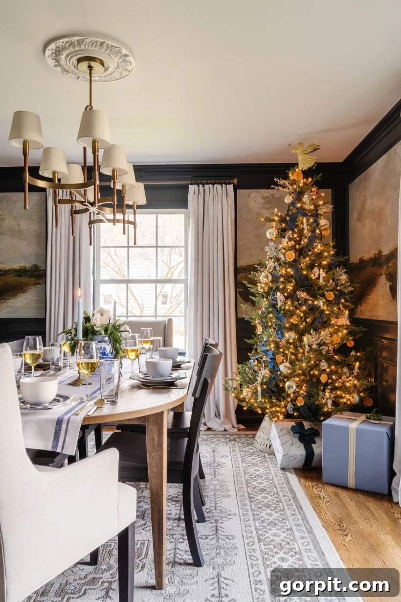 A beautifully decorated dining room for Christmas, featuring a prominent Christmas tree as a festive centerpiece.