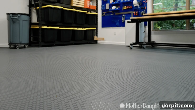 Elevate Your Garage: Smart Flooring Choices 7 Large roll of textured vinyl flooring laid out in a garage, demonstrating easy installation and protective qualities, ideal for heavy-duty garage use.