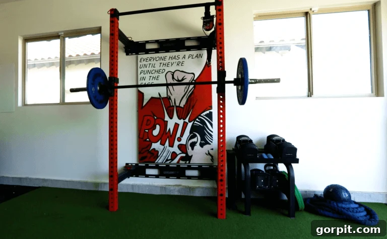 Elevate Your Garage: Smart Flooring Choices 8 A well-appointed home gym area within a modern garage featuring artificial turf flooring, enhancing both comfort and aesthetic appeal for various workouts.