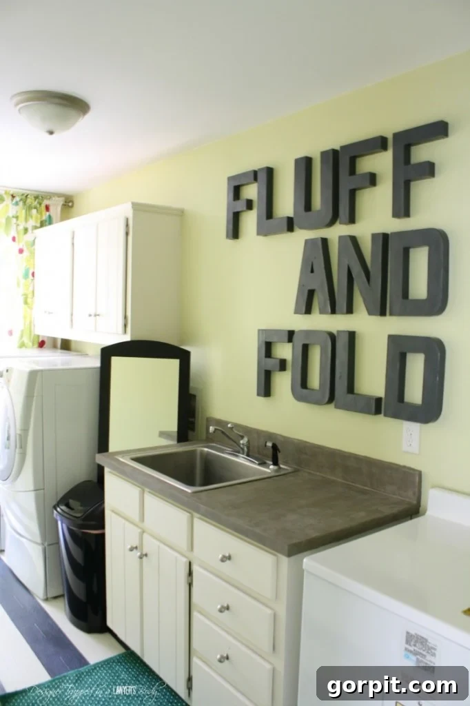 After photo of a vibrant and organized DIY laundry room makeover.