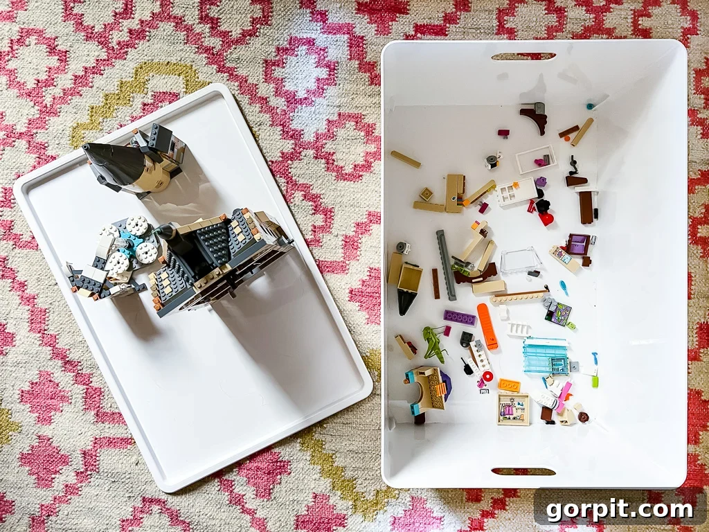 A plastic white bin and cover, as seen from above, are easy storage for LEGO and more. 