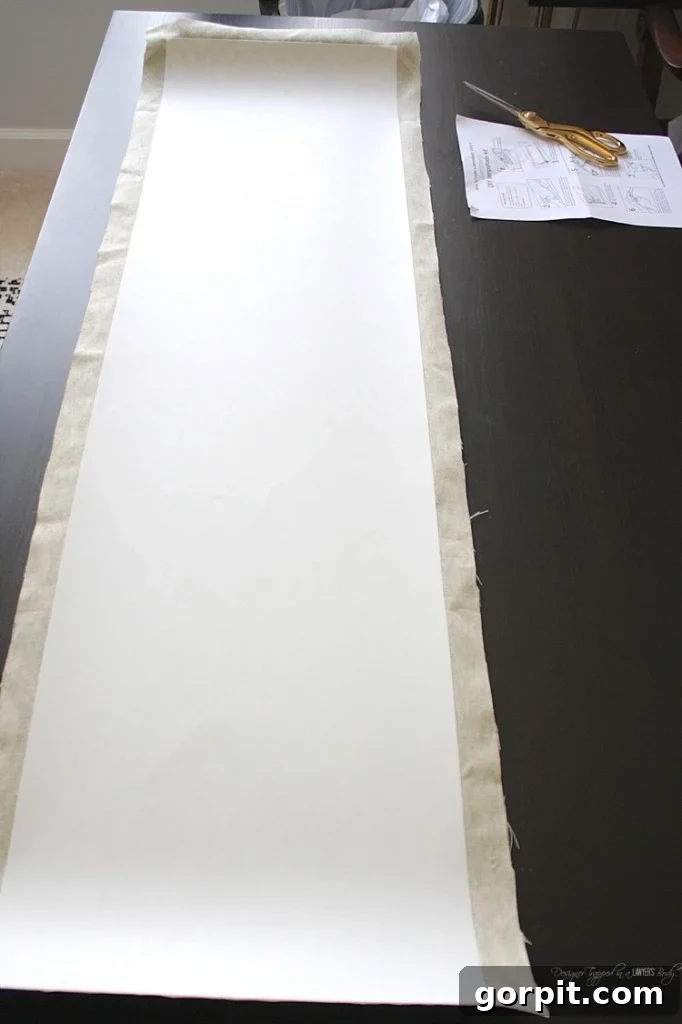 Craft Your Own Pendant Light 8 Trimming excess fabric around the styrene, leaving a consistent 1/2-inch overhang on three sides.