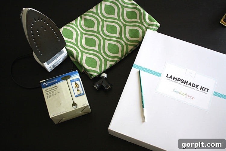 Craft Your Own Pendant Light 5 All materials laid out for DIY pendant light, including fabric, lampshade kit components, and a pendant light kit.
