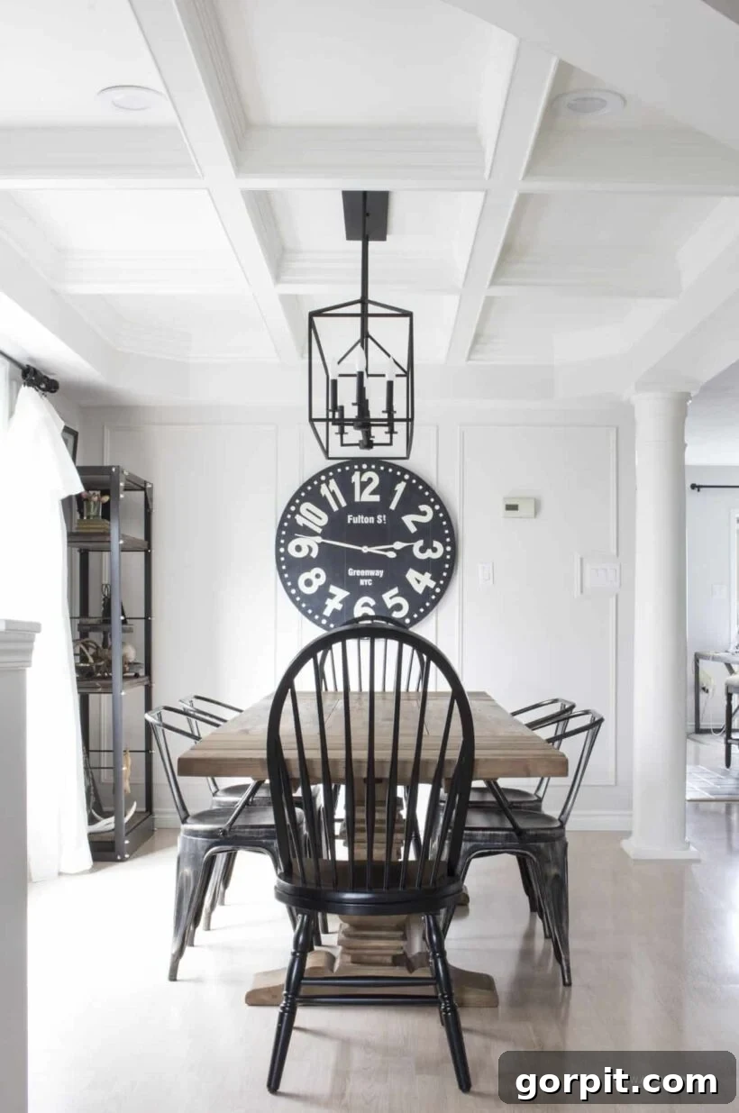 A beautifully crafted DIY coffered ceiling, showcasing intricate trim work and a clean, elegant design that enhances the room's sophistication.