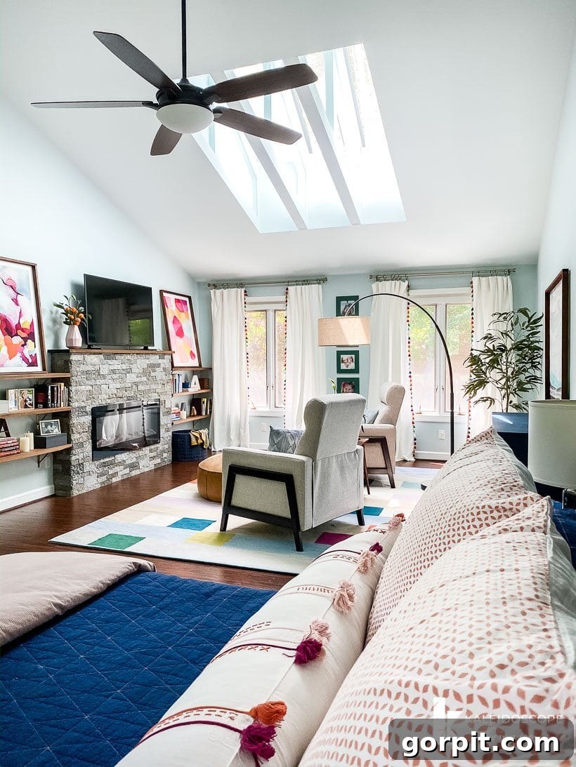 Bedroom with vaulted ceilings featuring exposed wooden joists and Velux skylights, creating an airy yet cozy atmosphere with architectural depth.