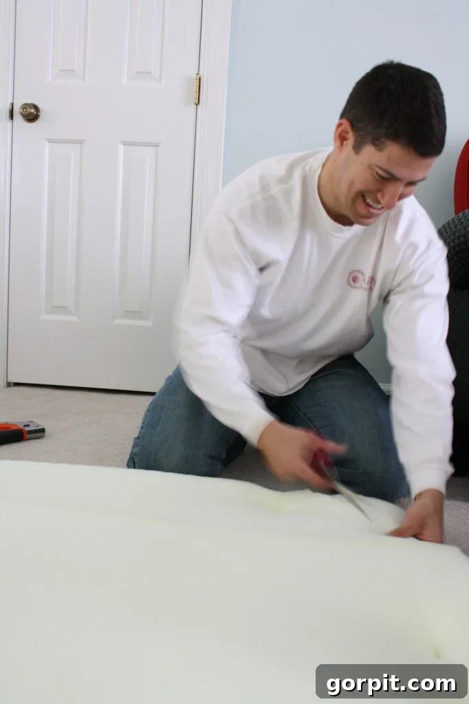 Trimming excess foam from the DIY upholstered headboard