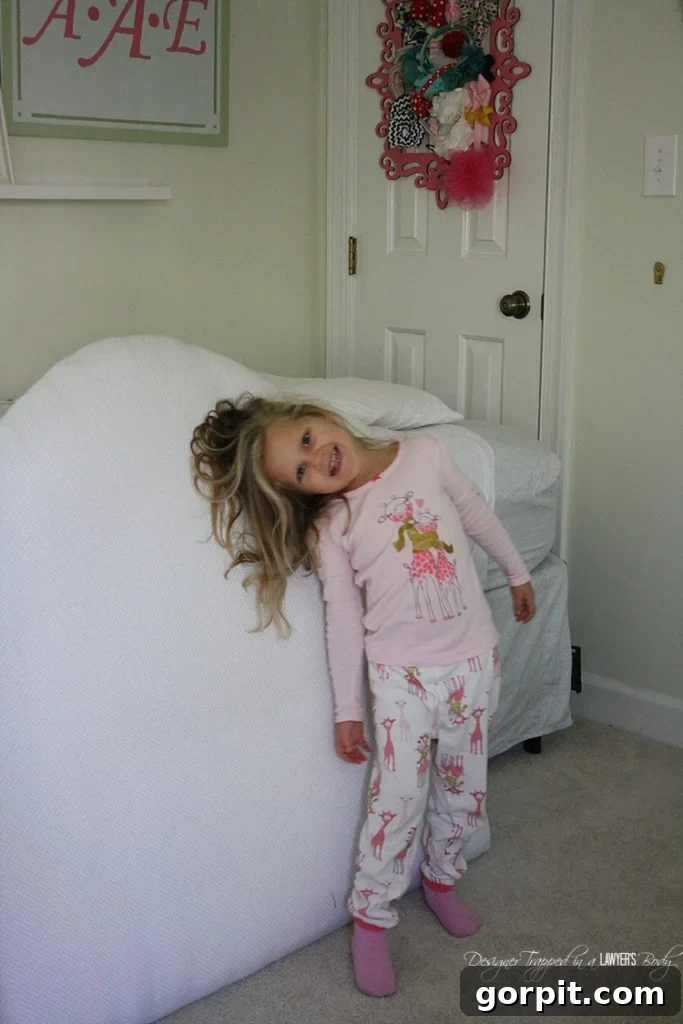 Re-upholstering the headboard with new pink fabric