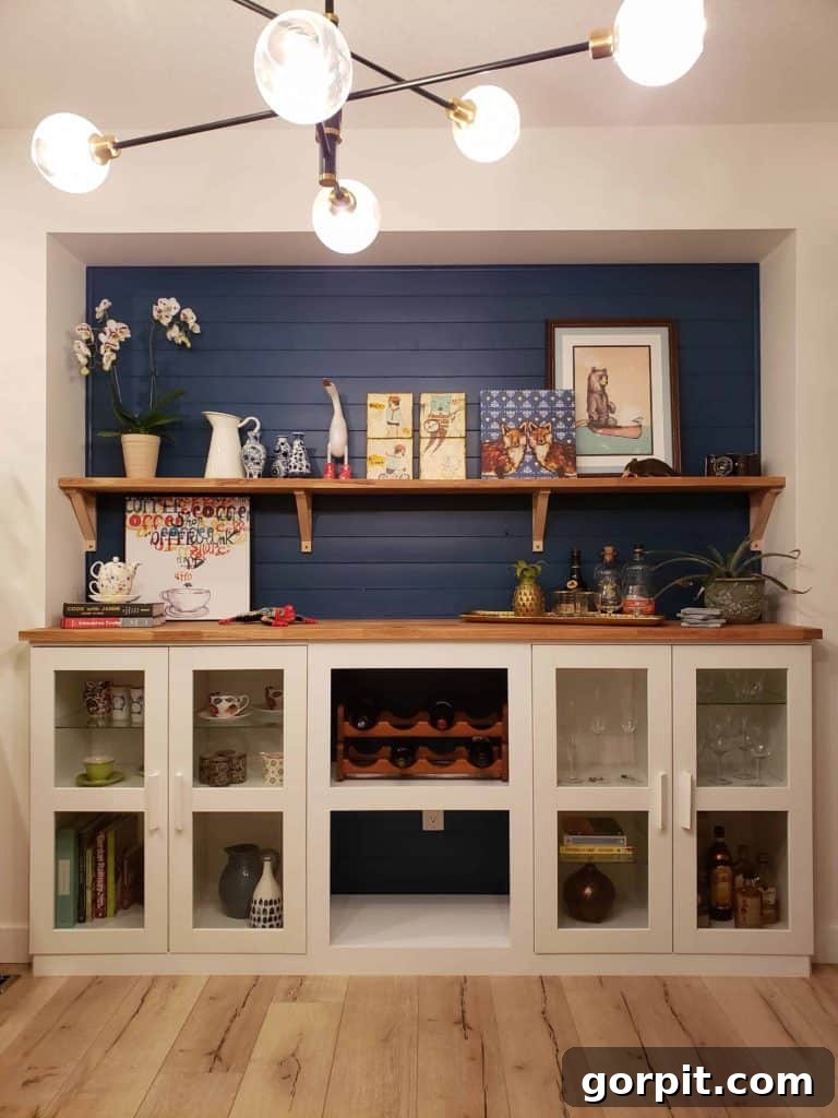 Budget-friendly built-in bar created with IKEA Brimnes bookshelves, shiplap, and a butcher block counter