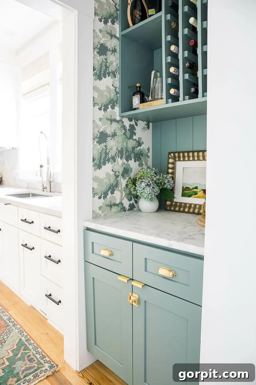Colorful and functional dry bar converted from a coat closet, featuring decorative wallpaper and open shelving