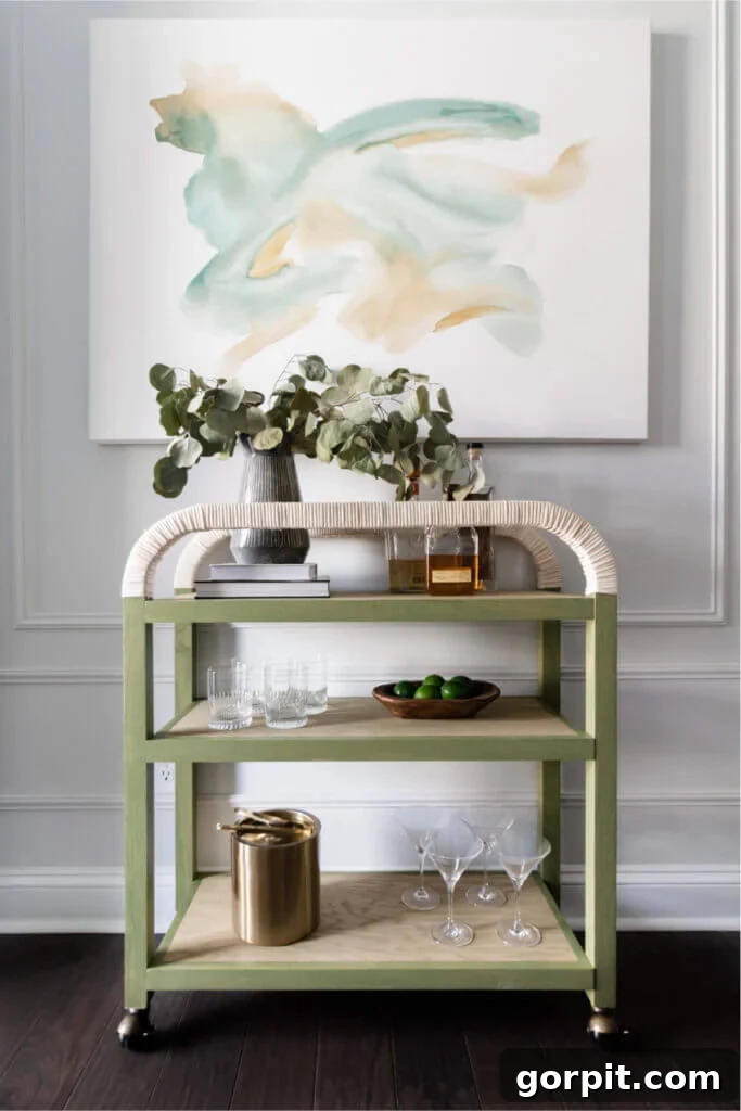 Charming DIY bar cart with rope handles, open shelving, and a curved top, ideal for small spaces