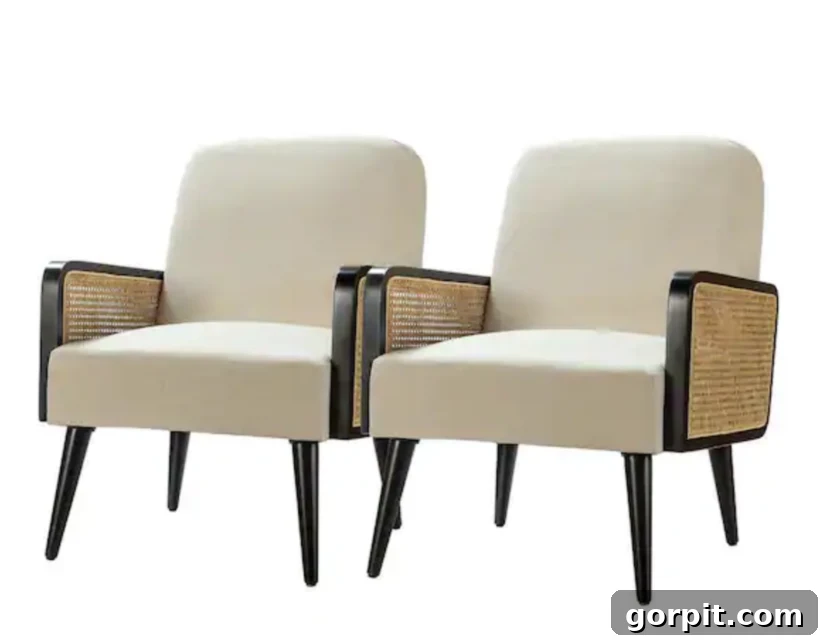 pair of ivory chairs with caned armrests